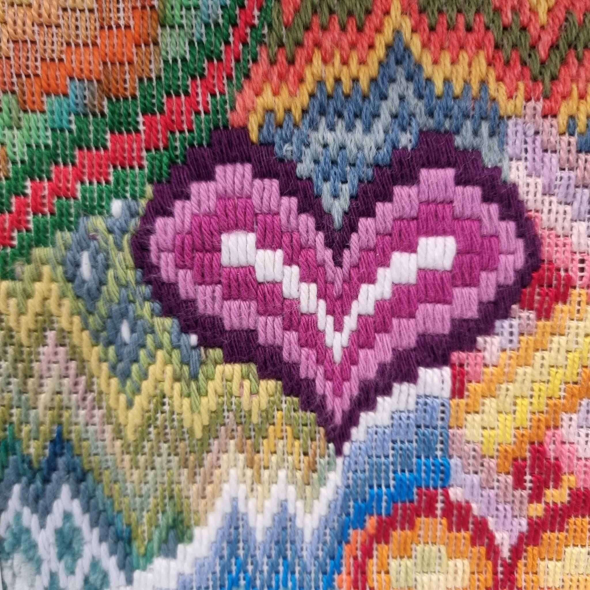 733342710_26930175036678810_4137852669243607372_n | Busy Bees Patchwork Close-up of a colorful knitted textile with rainbow stripes and a ribbed texture.